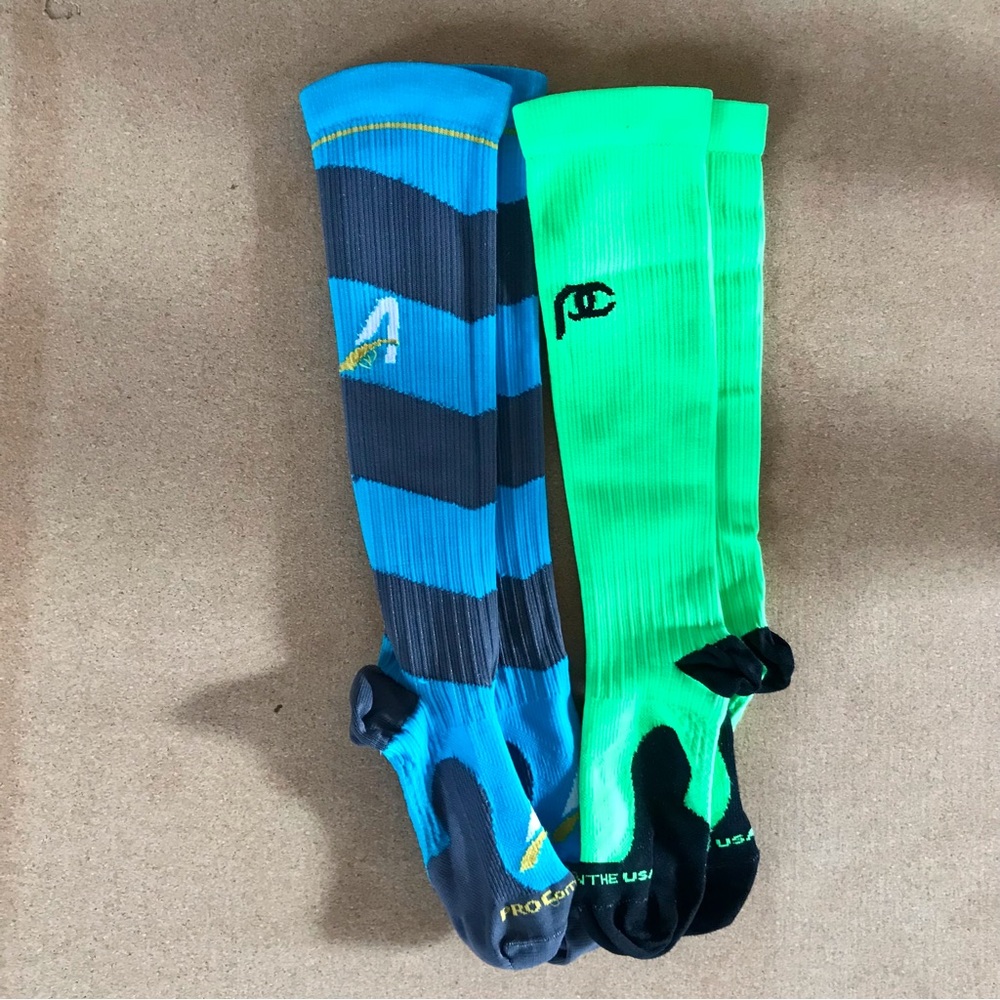 Two pairs of XS ProCompression Compressjon Socks—Neon Green & Blue/Gray Striped